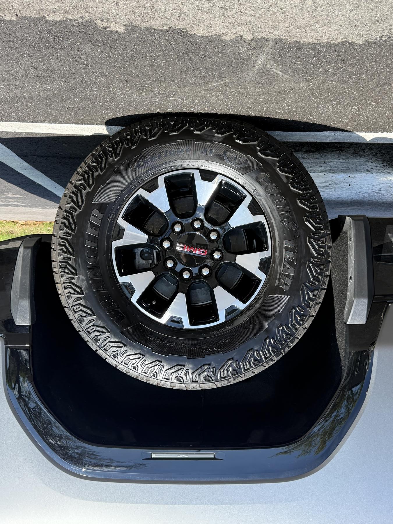 GMC truck wheel and tire after detail